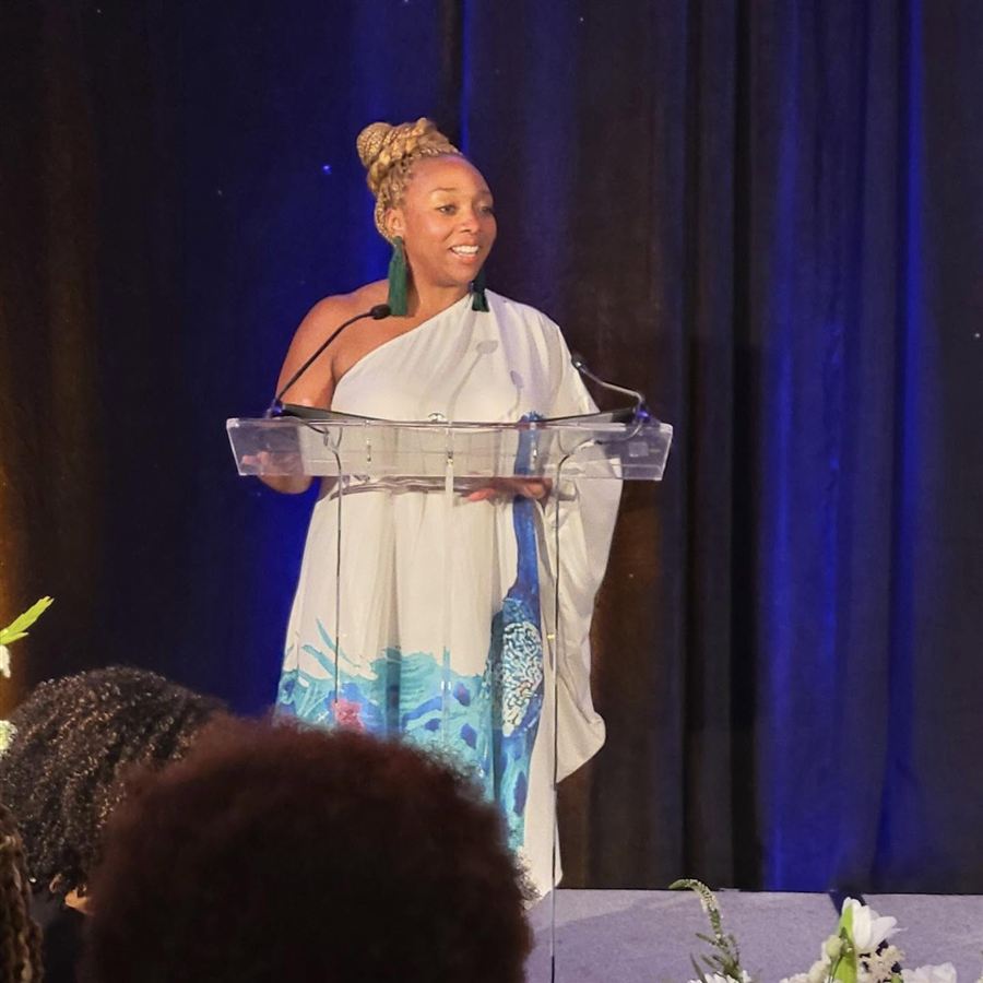 Candace N. Newell speaking at a community event