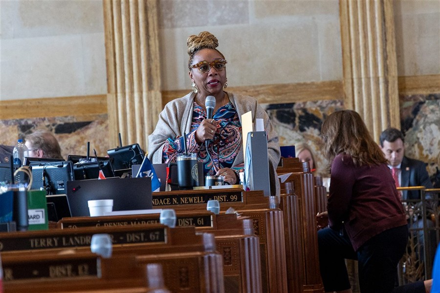 Candace N. Newell at her desk on the Louisiana House floor